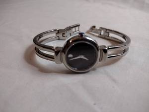 lot 92 image: Movado watch w silver band. Swiss made. Model 06 3 14 1013 Black face.