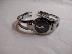 lot 93 image: Movado watch w silver band. Swiss made. Model 84 E4 1842 Black face.