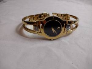 lot 95 image: Movado diamond gold plated watch. Swiss made. Diamonds tested. Sapphire crystal. Model 88 E4 1842 18 points of diamonds