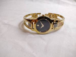 lot 96 image: Movado diamond gold plated watch. Swiss made. Diamonds tested. Sapphire crystal. Model 88 E4 1842 18 points of diamonds