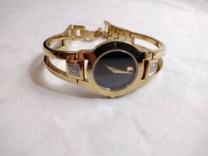 lot 97 image: Movado diamond gold plated watch. Swiss made. Diamonds tested. Sapphire crystal. Model 88 E4 1842 18 points of diamonds