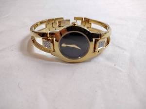 lot 98 image: Movado diamond gold plated watch. Swiss made. Diamonds tested. Sapphire crystal. Model 88 E4 1842 18 points of diamonds