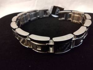 lot 107 image: Stainless Steel and diamond bracelet w textured stations. Diamonds tested.  8.5L