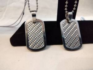 lot 119 image: (2) Stainless Steel ball bead and Carbon Fiber dog tag necklaces. Marked Carbon Fiber SHR