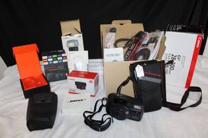 lot 169 image: Empty Canon Camera Boxes with Manuals, Empty Fire TV Stick Box, and Pentax 35mm Camera with Case