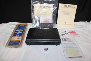 lot 183 image: Army Technical Manuals, Percussion Caps, Empty Magazines, Gun Care and Cleaning Kit