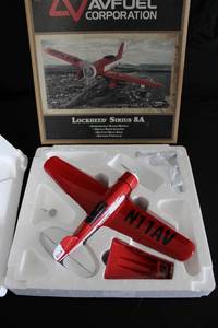 lot 198 image: Die Cast Airplane Bank Lockheed Sirius 8A Replica