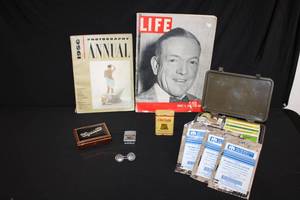 lot 199 image: Vintage Life magazine from 1940, Photography Annual from 1956, Vintage Cigarettes Containers, First Aid Kit, and Firefighter Zippo Lighter