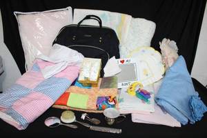 lot 232 image: Baby Lot Lovevook Diaper Bag, Baby Blankets (Quilts and Crocheted), Baby Vanity Set, Silver Sippy Cup, Baby Booties and More