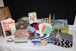 lot 252 image: Sewing Lot Fabric pieces, Buttons, Threads, Book and Sewing machine accessories