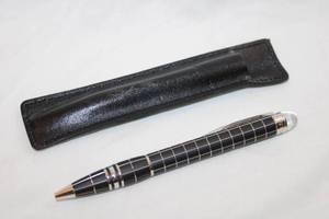 lot 31 image: MontBlanc Classic midnight black resin ballpoint pen with silver grid and leather cover