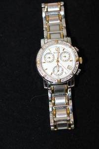 lot 38 image: Bulova diamond watch with two tone polished and matte link flex band and diamond surround. Diamonds tested. 16 diamonds. Model C937380 Luminescent hands