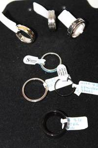 lot 42 image: (7) Stainless Steel ring selection. Varying styles. Sizes 9 to 13