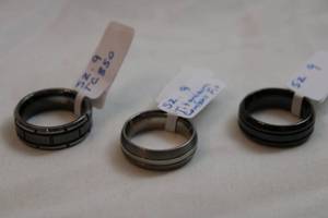 lot 45 image: (3) Titanium band rings. Marked. All size 9