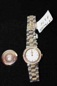 lot 395 image: Citizen Eco Drive non-working watch w two tone gold and silver band and crystal accents. Model B023-806503