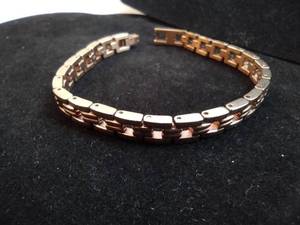 lot 108 image: Stainless Steel gold tone polished finish link bracelet w crystal accents. Fold over clasp. 7L