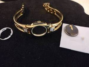 lot 397 image: Movado diamond non-working watch. Gold with black face. Diamonds tested. 18 diamonds. Model 81 E4 1842