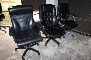 lot 28 image: 3 Rolling Black Office Chairs - 3 Different Styles
