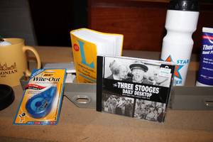lot 153 image: Shelf Contents Mugs, Wite-Out, Dictionary, The Three Stooges Daily Desktop CD, Candles, Square Lazy-Susan