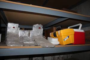 lot 372 image: Clear Plastic Table Display Stands, Cooler, Plastic Tool Box, and Sanitizer Dispenser