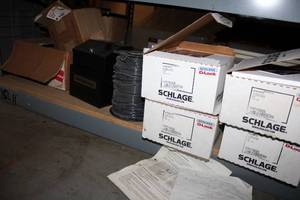 lot 446 image: Round Door Knobs, Spool of Wire, Lock Box, Electric Outlet Boxes, White Shelving