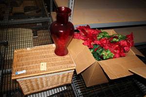 lot 559 image: Large Red Glass Vase with Artificial Poinsettias and Willow Lined Trunk with World Market Tag