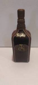 lot 131 image: Leather and cowhide bound Tequila bottle (EMPTY)