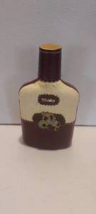 lot 134 image: Leather and cowhide bound whiskey bottle (EMPTY)