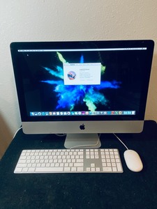 lot 24 image: Apple iMac 21.5 Mid 2010 8GB 1TB Intel Core i3 3.06GHz in Silver Grade B