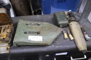 lot 128 image: Vintage Military Items Shovel, Knives, First Aid Kit, Flare, and Portable Burner
