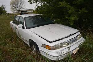 lot 168 image: 1997 Crown Victoria LX 4-Door 4.6L Engine, with Clear TX Title, last Licensed in 2019. Last driven in 2020. Coolant leak at thermostat housing.