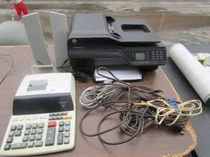 lot 56 image: HP printer with plug unknown working order, misc electric cords, Sharp electric calculator and 2 computer speakers