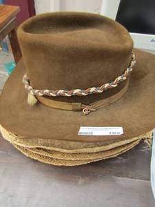lot 102 image: wicker cowboy hats qty 4 and a resistol self confidence western hat brown in color