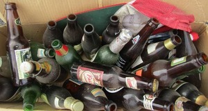 lot 107 image: Various vintage beer bottles includes, saint polly, jack daniels, lowenbrau, bass& pale ale and many more