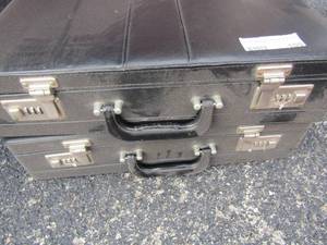 lot 109 image: 2 black brief cases