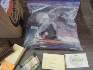 lot 125 image: Lot of used mini travel size soaps, lotions, shampoos,  small bag of used make up, eye shadow, lip liner, blush and more