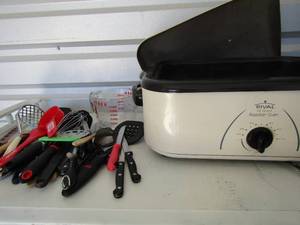 lot 185 image: Rival 16 qt roaster over, barley used, measuring cup chipped and various other kitchen utensils