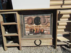 lot 198 image: 3050 wooden western wall hanger with side space for nick necks, made out of all wood, picture in middle of western boots and hats
