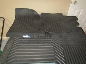 lot 60 image: Set of 4 black floor mats in good condition,