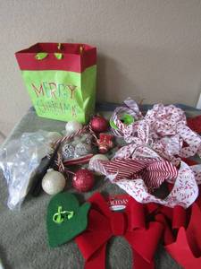 lot 75 image: Christmas lot includes, large new bows, ribbon, small dcor pieces, a few tree ornaments
