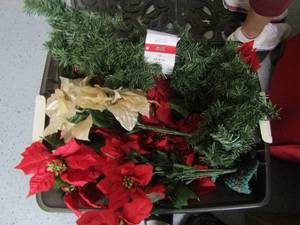 lot 76 image: Tote of Poinsettes and new packs of garland