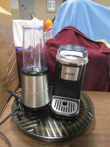 lot 24 image: 2 Lazy Susans, Fiber ware chopper, 1 cup espresso maker