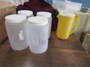 lot 51 image: 1 yellow tea picture, 4 plastic containers with lids all are 1 gallon each like new