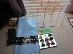 lot 58 image: Misc. lot of bells, gift tissue paper, candle holders and shower curtain rings New