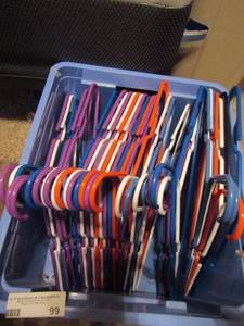 lot 99 image: Small blue tub of plastic hangers, seem new