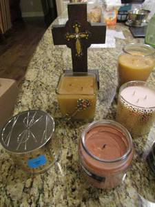 lot 116 image: Small cross, various new candles,  never used      scents are amazing