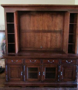 lot 14 image: UNIVERSAL FURNITURE 2 piece TV entertainment top piece has 4 tier space on each side, bottom half has 4 drawers and 4 doors for storage purposes beautiful piece 84 X 80 X 22   ( NO CONTENTS INCLUDED)