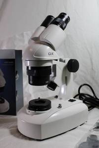 lot 2 image: GIA Approved Gemological Presentation scope Microscope in box w user guide and accessories.