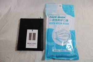 lot 23 image: Leather Passport bifold wallet and collar stays. Monogrammed Passport on front. Unused. Also comes with a package of COVID masks for trip preparation.