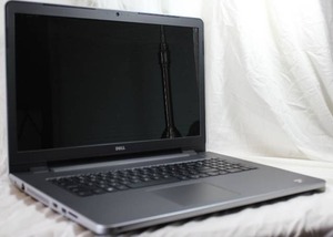 lot 28 image: Dell Inspiron AMD Quad core - 17 inch Laptop (5755 series) w power cord, Quick start booklet and warranty card.